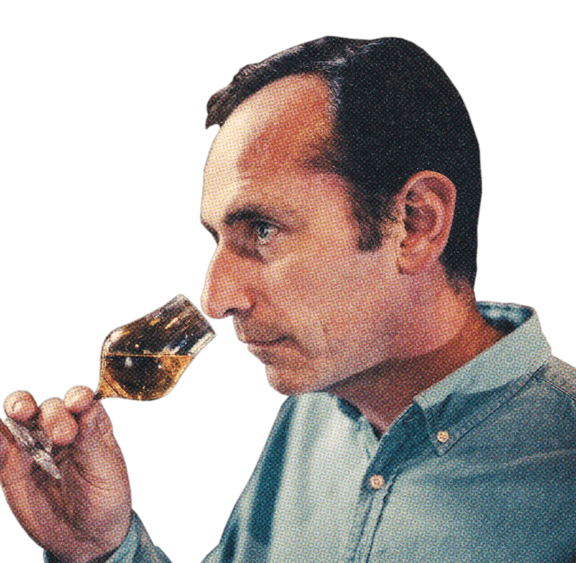 Kellermeister Eric Durand prüft ein Glas Weinbrand